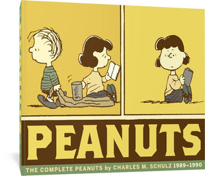 The cover to The Complete Peanuts 1989 - 1990: Vol. 20 Paperback Edition, featuring the title and author's name in a blocky font. Above the title are two panels from the comic, showing Linus walking by Lucy with his blanket dragging on the floor as she places a glass on top without looking. In the second panel, she looks around in confusion as the glass has vanished with Linus, who has continued walking out of the frame.