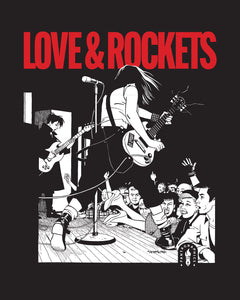 A crowded punk show scene with Terry Downe playing guitar and Hopey Glass playing bass on a raised stage. Printed in white on a black shirt background with the words "Love and Rockets" printed above in red. 